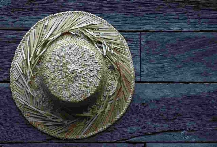 Old Straw hat Wooden Surface